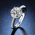 Elegant six-prong silver ring with a round brilliant cut moissanite on blue background - Y073【1 Carat】