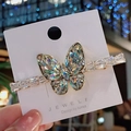 Fermaglio per capelli a farfalla scintillante in lega dorata con cristalli di zircone - Bianco