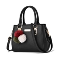Fashionable black pebbled leather handbag with gold hardware and colorful pompom charm - Black