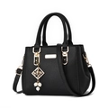 Black litchi grain tote bag with gold hardware and elegant pearl charm detail - Black Bead Charm