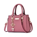 Pink pebbled leather handbag with gold hardware and detachable shoulder strap - Dusty Pink With Pearl Pendant