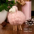 Detail shot of a pink wool felt sheep ornament showing 12cm height and 10cm length - Pink