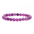 Detailed view of natural purple stone beads with authentic texture and elastic cord - Translucent Purple
