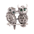 Retro silver owl brooch with green rhinestone eyes and crystal accents on a branch - Vintage Oxidized Silver Double Owl