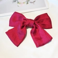 Barrette nœud papillon en satin rouge bordeaux avec texture soyeuse raffinée - Clip à ressort en satin / Bordeaux (Satin)