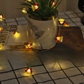 Christmas string lights with golden bells and red bows on copper wire for holiday decor - 1m 10-LED (2AA Battery Model) / Bell