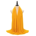 Elegant yellow pearl chiffon hijab scarf shown on a mannequin with soft drape texture - Bright Orange