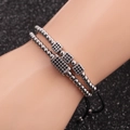 Double-layered silver beaded bracelet with micro-pave black zircon cube accents on wrist - Set / White Gold
