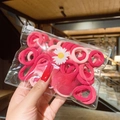 Detail of high-elasticity nylon hair ties in red and pink tones inside a zip-lock pouch - 50 Pcs Bag / Rose Red