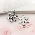 Pair of bright silver snowflake alloy charms for DIY jewelry on decorative background - 16x21mm Snowflake-8390