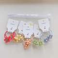 Set mit 10 bunten elastischen Haargummis mit Blumen für Mädchen in Pastellfarben - Fünfblättrige Blume