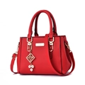 Minimalist red leather handbag with lychee texture, golden hardware and pearl charm - Red With Pearl Pendant