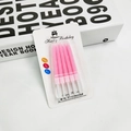 Five pieces of pink spiral birthday candles in blister card packaging for cake decor - 5 Pcs Set / Pink