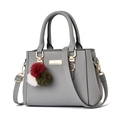 Gray pebble leather tote bag with gold hardware and three-color fur ball pendant - Light Gray