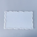 Close-up of a translucent rectangular silicone mold with wavy edges for resin DIY crafts - Small Irregular Mirror Rectangular Tray Mold