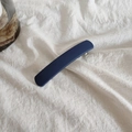 Macro detail of dark blue matte acrylic hair clip with silver metal spring buckle - Navy Blue