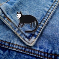 Detail of gothic black cat skeleton enamel pin on a denim jacket pocket - Skeleton Mask Black Cat