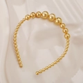 Elegant gold beaded headband with gradient size pearls on a beige silk fabric backdrop - Gold Metal Bead Style