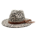 Detailed view of leopard print fedora hat with brown leather band and bow decoration - Beige