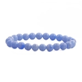 Close-up of blue agate beads with natural white sand texture on an elastic bracelet - Blue Sand Texture
