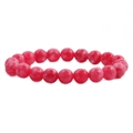 Detailed macro view of faceted red agate stone beads on an elastic bracelet - Magenta Faceted