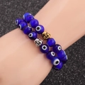 Deep blue evil eye beaded bracelets with gold and silver Buddha head charms - Blue Set
