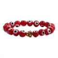 Red evil eye beaded bracelet featuring a vintage golden Buddha head charm on a white base - Red Eye Gold Buddha Head