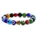 Detailed view of colorful evil eye beads and golden buddha head on an elastic bracelet - Multicolor Eye Gold Buddha Head