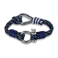 Macro view of woven paracord bracelet with stainless steel D-shackle buckle and knot detail - Blue
