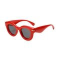 Retro thick red frame sunglasses with dark lenses and gold metal accents in 45-degree view - Red Frame Grey Lens