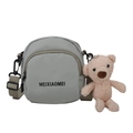 Sage green round crossbody bag with cute plush bear pendant and black text print - Green with Bear Charm