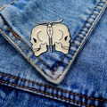 Detail of a butterfly enamel pin with skull motif on a blue denim jacket pocket - Butterfly Skull (13)