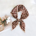 Chic brown floral ribbon scarf tied in a bow with delicate white flower pattern - Floral Brown