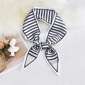 Classic black and white striped silk scarf tied in a stylish knot on a plush white surface - Striped White
