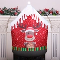 Christmas chair cover featuring a reindeer and Warm Wishes text in festive red and green - Elk