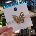 Fermaglio per capelli a farfalla in cristallo champagne con finitura in oro su carta - Champagne