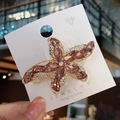 Pasador de pelo dorado en forma de estrella con cristales champán y pedrería - Rosa Púrpura