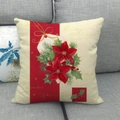 Christmas linen pillowcase with red poinsettia and berry pattern on a gray sofa - Style 19