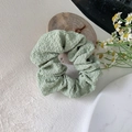Morandi green mesh scrunchie with bubble texture fabric on a minimalist floral background - Bubble Light Green