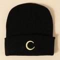 Close-up of black knitted beanie with yellow moon embroidery and ribbed texture - M (56-58cm) / Black