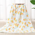 Soft multi-layer cotton gauze baby blanket featuring yellow lemon prints on white - Big Pomelo
