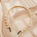 Detail of elegant gold metal headband with various sized white pearls on satin - Gold Wire Pearl