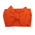 Detail of a bright orange textured knit bow headband for infants with a soft elastic fabric - Orange