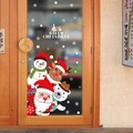 Close-up of Santa Claus and Reindeer Christmas decals on a glass shop door - Cartoon Characters (HM92045)