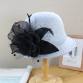 Elegant grey wool felt fascinator hat with black floral mesh detail on a wooden stand - Adjustable / Grey with Black Flower