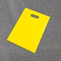 Vibrant yellow PE plastic shopping bag with die-cut handle for retail and gift packaging - Yellow