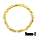 Detailed view of 5mm polished gold beaded elastic bracelet with high shine finish - 5mm / Gold