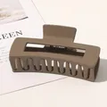 Close-up of a large matte brown rectangular hair claw clip with geometric hollow design - 10.5cm Rectangular - Matte Light Coffee