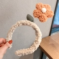 Cute beige lamb wool headband featuring an orange plush flower with green leaf detail - Orange Flower