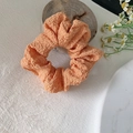 Floral print mesh scrunchie in vibrant coral orange with pleated fabric texture - Bubble Orange